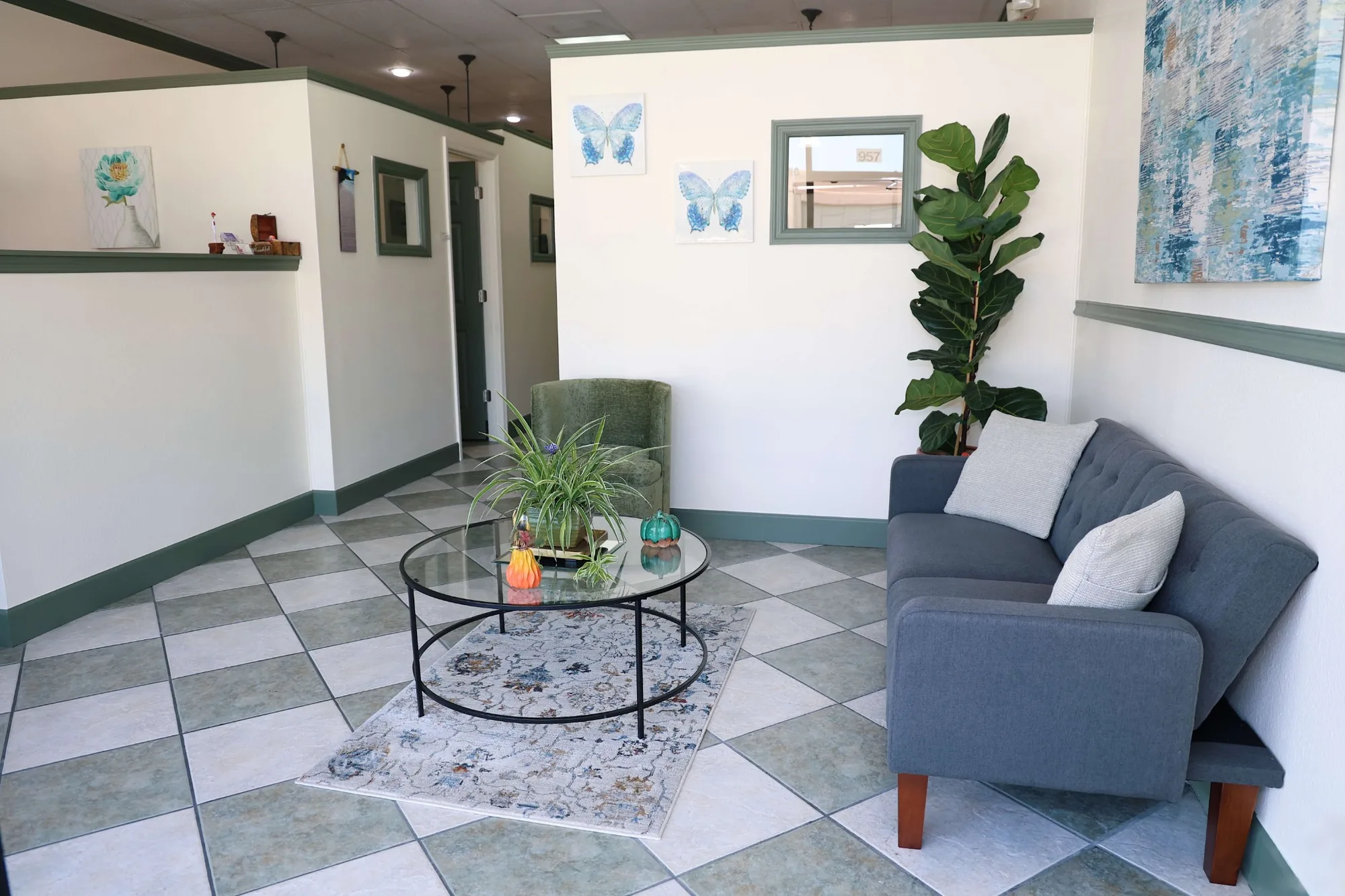 Reception and lobby seating area at Kani Salon Suites in Casselberry, Florida